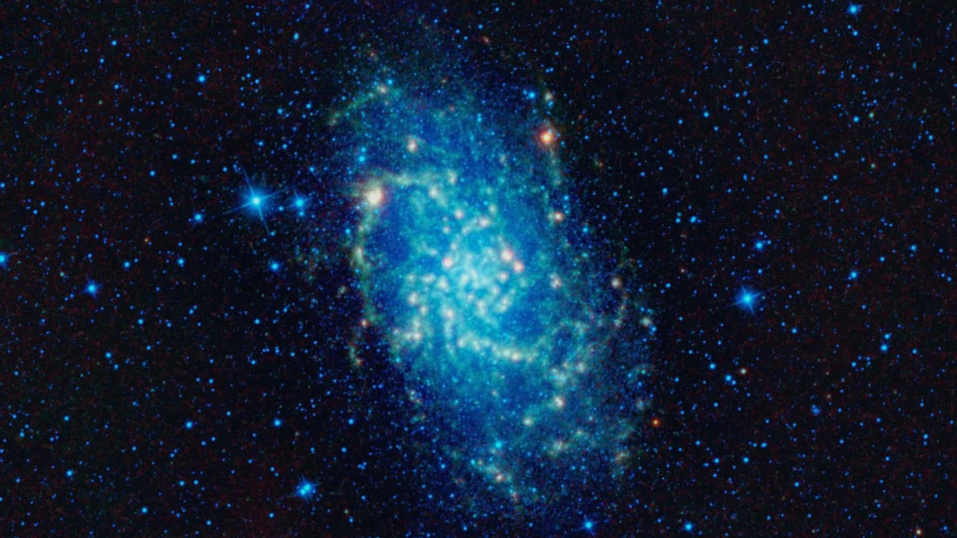 WISE kızılötesi gözlem uydusu ile görüntülenen Üçgen Galaksisi (NASA, JPL-Caltech)